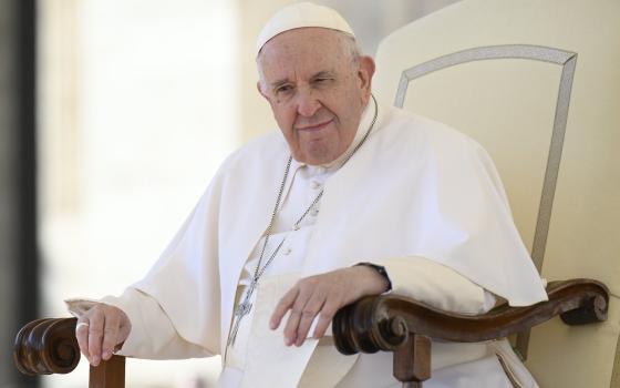 Pope Francis pauses as he speaks to more than 60,000 members of the Communion and Liberation movement in St. Peter's Square at the Vatican Oct. 15, 2022. The audience was part of the movement's celebration of the 100th anniversary of the birth of the late Father Luigi Giussani, the movement's founder.